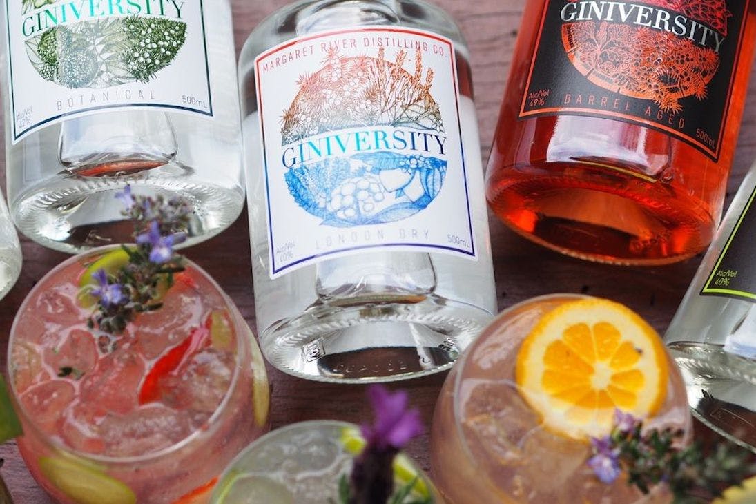 Glasses and bottles of Giniversity gin